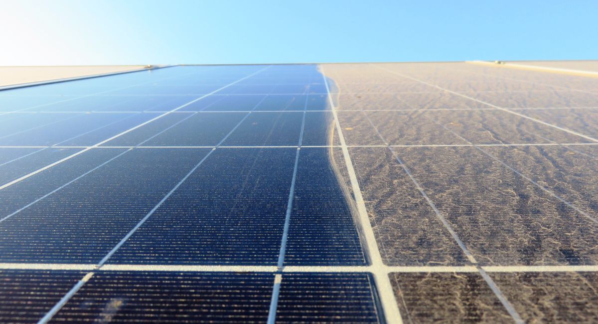 Solar panels cleaned on the left, caked in desert dust on the right