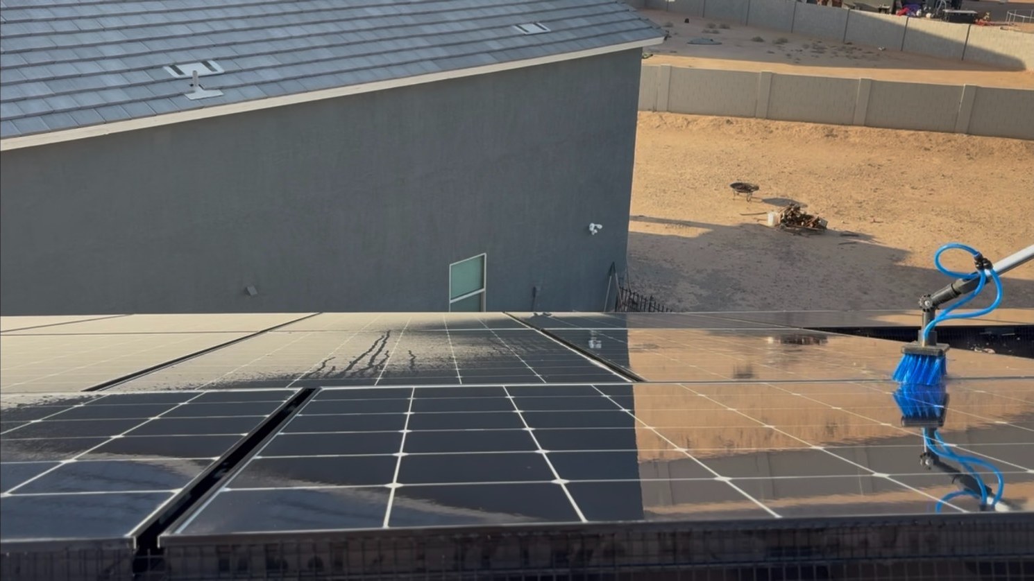 Deionized water and soft-bristle brush on a rooftop array